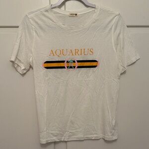 LIKE NEW Piece Apparel Aquarius White Short Sleeve Graphic Tshirt